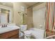 Bathroom features a shower-tub combo, tile accents, and a vanity with drawers at 19814 Lindenmere Dr, Monument, CO 80132