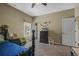 bedroom features a dark wood bed frame, carpet, and ceiling fan at 19814 Lindenmere Dr, Monument, CO 80132