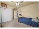 Spacious bedroom has a ceiling fan, and a door to a locker room themed closet at 19814 Lindenmere Dr, Monument, CO 80132