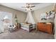 Adorable bedroom with ceiling fan, canopy bed, natural light and charming decor at 19814 Lindenmere Dr, Monument, CO 80132