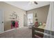 Neutral bedroom featuring a cozy panda chair, decorative wall decor and plush carpet at 19814 Lindenmere Dr, Monument, CO 80132