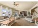 Cozy living room featuring natural light, neutral decor, and open floor plan at 19814 Lindenmere Dr, Monument, CO 80132