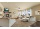 Inviting living room with a stone fireplace, lots of natural light, and plush seating at 19814 Lindenmere Dr, Monument, CO 80132