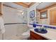 Stylish bathroom features a glass-enclosed shower, unique blue sink, and modern fixtures at 78 Fairway Ln, Littleton, CO 80123