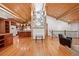 Spacious living area with wood ceiling open to a kitchen at 78 Fairway Ln, Littleton, CO 80123