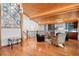 Open-concept living room featuring a wood ceiling, and large windows for natural light at 78 Fairway Ln, Littleton, CO 80123