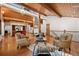 Inviting living room boasts hardwood floors, vaulted wood ceilings and large windows offering natural light at 78 Fairway Ln, Littleton, CO 80123