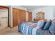 Serene main bedroom with wood-trim features offers a relaxing retreat with an ensuite bath at 78 Fairway Ln, Littleton, CO 80123