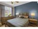 Inviting bedroom with large windows, bedside tables and soft lighting at 6476 Silver Mesa Dr # A, Highlands Ranch, CO 80130