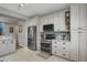 Modern kitchen with stainless steel appliances and a decorative tile backsplash at 6476 Silver Mesa Dr # A, Highlands Ranch, CO 80130