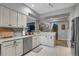 Well-equipped kitchen with updated cabinets and stainless steel dishwasher at 6476 Silver Mesa Dr # A, Highlands Ranch, CO 80130