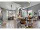 Open concept kitchen and dining area with stainless steel appliances and ample sunlight at 6476 Silver Mesa Dr # A, Highlands Ranch, CO 80130