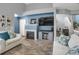 Comfortable living room showcasing a fireplace, entertainment center, and modern finishes at 6476 Silver Mesa Dr # A, Highlands Ranch, CO 80130