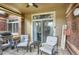 Inviting patio with grill, seating, and brick accents, perfect for outdoor entertaining at 6476 Silver Mesa Dr # A, Highlands Ranch, CO 80130