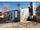 Rear exterior showcasing the siding and yard space at 14991 E Elk Pl, Denver, CO 80239