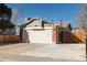 Charming home featuring a two-car garage and a well-maintained lawn at 14991 E Elk Pl, Denver, CO 80239