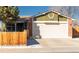 Charming home featuring a two-car garage and a well-maintained lawn at 14991 E Elk Pl, Denver, CO 80239