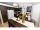 Cozy kitchen featuring modern appliances and dining table at 14991 E Elk Pl, Denver, CO 80239