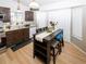 Cozy kitchen featuring modern appliances and dining table at 14991 E Elk Pl, Denver, CO 80239