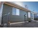 Exterior showcasing the siding, windows and yard at 14991 E Elk Pl, Denver, CO 80239