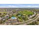 Aerial view of neighborhood with nearby community center, pool, and sports fields at 378 Benton St, Castle Rock, CO 80104