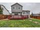 Home's backyard with stained wood deck and grassy area at 378 Benton St, Castle Rock, CO 80104