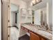 Bathroom featuring granite countertops, mosaic backsplash and dark tile flooring at 378 Benton St, Castle Rock, CO 80104