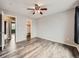 Bright, airy bedroom features wood floors, a ceiling fan and a walk-in closet at 378 Benton St, Castle Rock, CO 80104