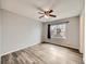 Bedroom with wood floors, neutral walls, and a large window providing natural light at 378 Benton St, Castle Rock, CO 80104