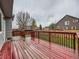 Well-maintained wood deck overlooking a green fenced-in backyard on a cloudy day at 378 Benton St, Castle Rock, CO 80104