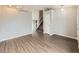Open living room with hardwood floors, neutral walls, and staircase to the upper level at 378 Benton St, Castle Rock, CO 80104