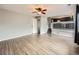 Living room boasts hardwood floors, neutral paint, and open access to the updated kitchen at 378 Benton St, Castle Rock, CO 80104