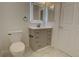 Clean bathroom with a toilet, and vanity with drawers and cupboards, and illuminated mirror at 2809 Syracuse Ct # 129, Denver, CO 80238