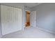 Cozy bedroom with carpet, closet, and access to the hallway at 2809 Syracuse Ct # 129, Denver, CO 80238