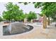 Beautiful community fountain with surrounding green spaces and gathering areas at 2809 Syracuse Ct # 129, Denver, CO 80238