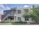 Contemporary home with multiple levels, a small balcony, and fresh landscaping at 2809 Syracuse Ct # 129, Denver, CO 80238