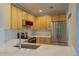 Charming kitchen boasting stainless appliances, updated cabinets, and a stylish backsplash for modern living at 2809 Syracuse Ct # 129, Denver, CO 80238