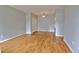 Open-concept living room featuring wood floors, ample natural light, and neutral paint creating a serene environment at 2809 Syracuse Ct # 129, Denver, CO 80238