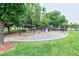 Community playground with swings, a slide, and lush green surroundings at 2809 Syracuse Ct # 129, Denver, CO 80238