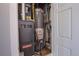 The utility closet has a furnace and a hot water heater at 2809 Syracuse Ct # 129, Denver, CO 80238