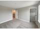 Light-filled bedroom featuring a walk-in closet and a modern, neutral aesthetic at 11650 Lewiston Ct, Commerce City, CO 80022