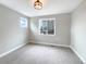 Bright, empty bedroom with ample natural light, neutral paint, and plush carpeting at 11650 Lewiston Ct, Commerce City, CO 80022