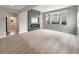 Bright living room featuring large windows and a fireplace, creating an inviting space at 11650 Lewiston Ct, Commerce City, CO 80022