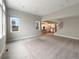 Spacious, bright living room with large windows, an open floor plan, and access to the kitchen at 11650 Lewiston Ct, Commerce City, CO 80022