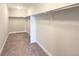 Walk-in closet with carpet, shelving, and hanging rods at 11650 Lewiston Ct, Commerce City, CO 80022