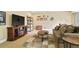 Inviting basement space featuring a fireplace, TV, comfortable seating, and decor at 26143 E Fremont Pl, Aurora, CO 80016