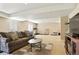 Finished basement featuring neutral walls, carpeted floors, and a comfortable seating area with home gym at 26143 E Fremont Pl, Aurora, CO 80016