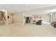 Large open basement with carpet, entertainment area and stairs at 26143 E Fremont Pl, Aurora, CO 80016
