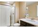 Bright bathroom features glass shower, neutral walls, vanity with quartz countertop and fixtures at 26143 E Fremont Pl, Aurora, CO 80016