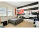 Bright bedroom with striped accent wall, sports-themed decor, and a playful atmosphere at 26143 E Fremont Pl, Aurora, CO 80016